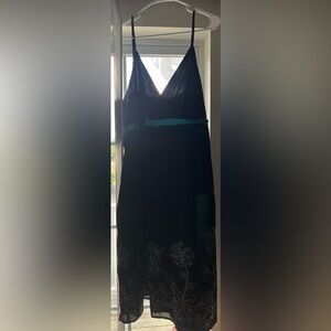 Studio 1940 black spaghetti strap dress with teal band and flowers.